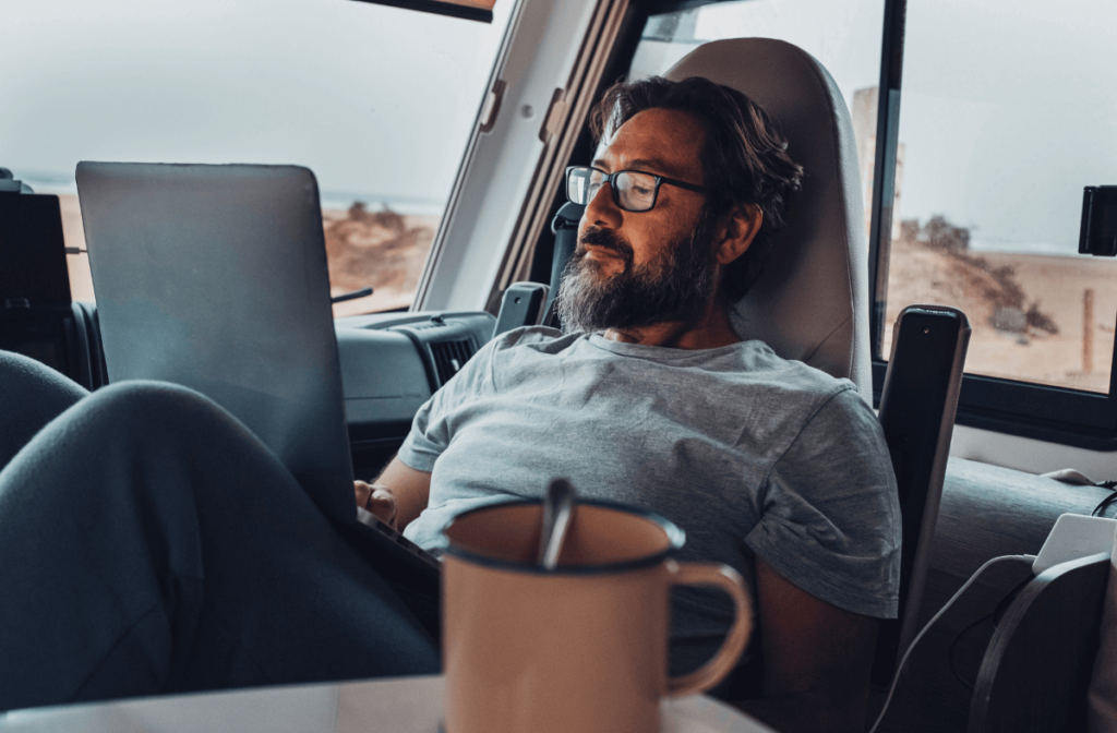 Man sitting inside campervan